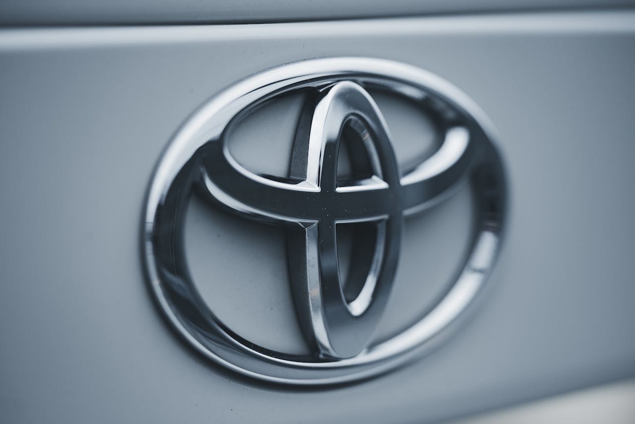 Mastering the First Impression: Your intriguing post title goes here Detailed image of a shiny silver Toyota emblem on a vehicles surface.